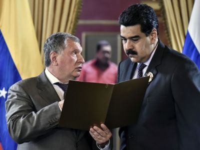 Глава корпорации "Роснефть" Игорь Сечин и президент Венесуэлы Николас Мадуро. Фото: Carlos Becerra / Bloomberg